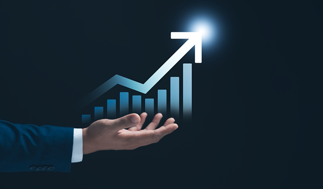 Hand presenting increasing financial growth graph.