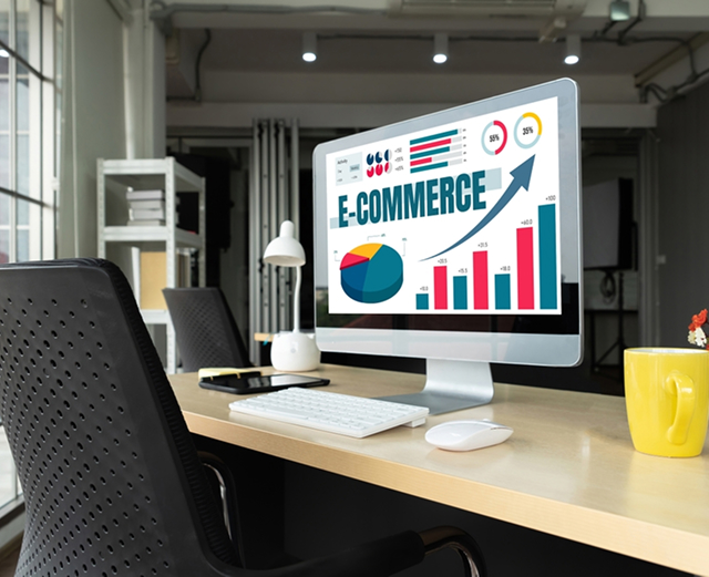 E-commerce growth chart displayed on office computer.